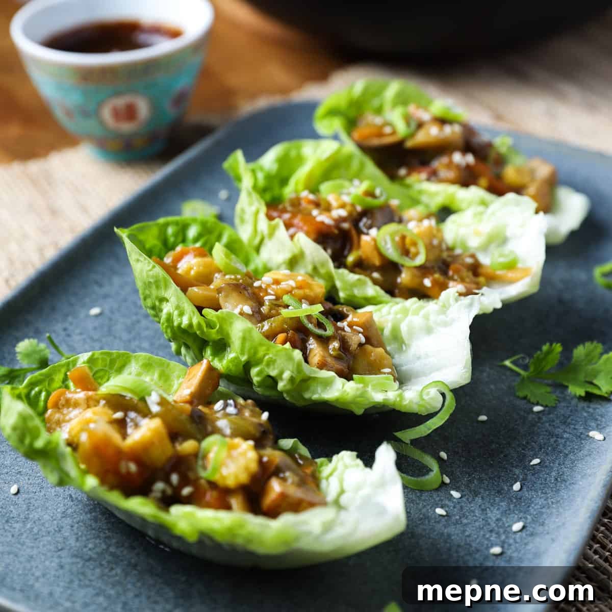 Crispy Chinese Fried Oyster Mushrooms with Vegan Char Siu Recipe 10 Photo of 4 lettuce leaves with vegan san choy bau filling inside.