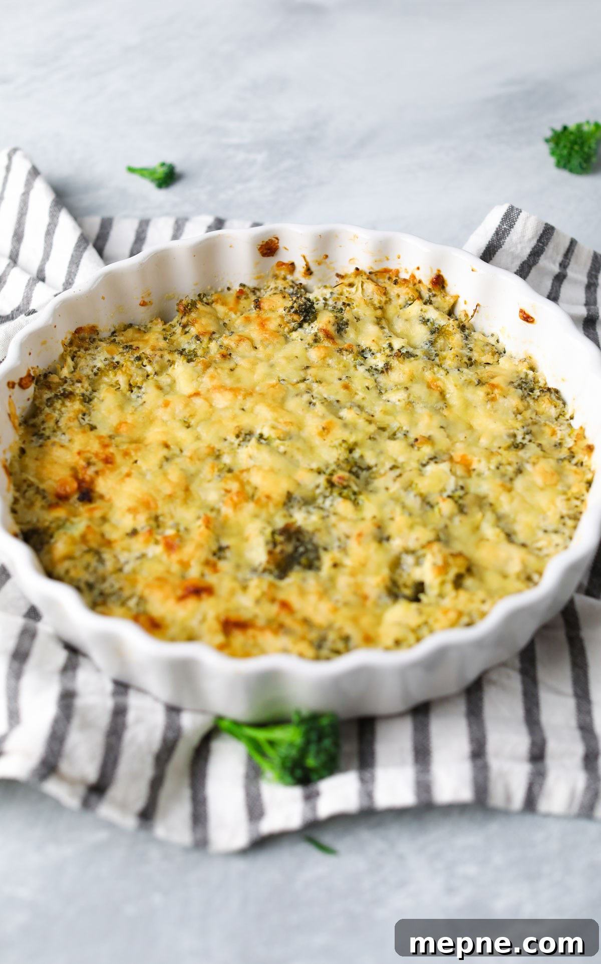 5-Ingredient Keto Broccoli Casserole Recipe 3 dish of broccoli casserole on dish towel