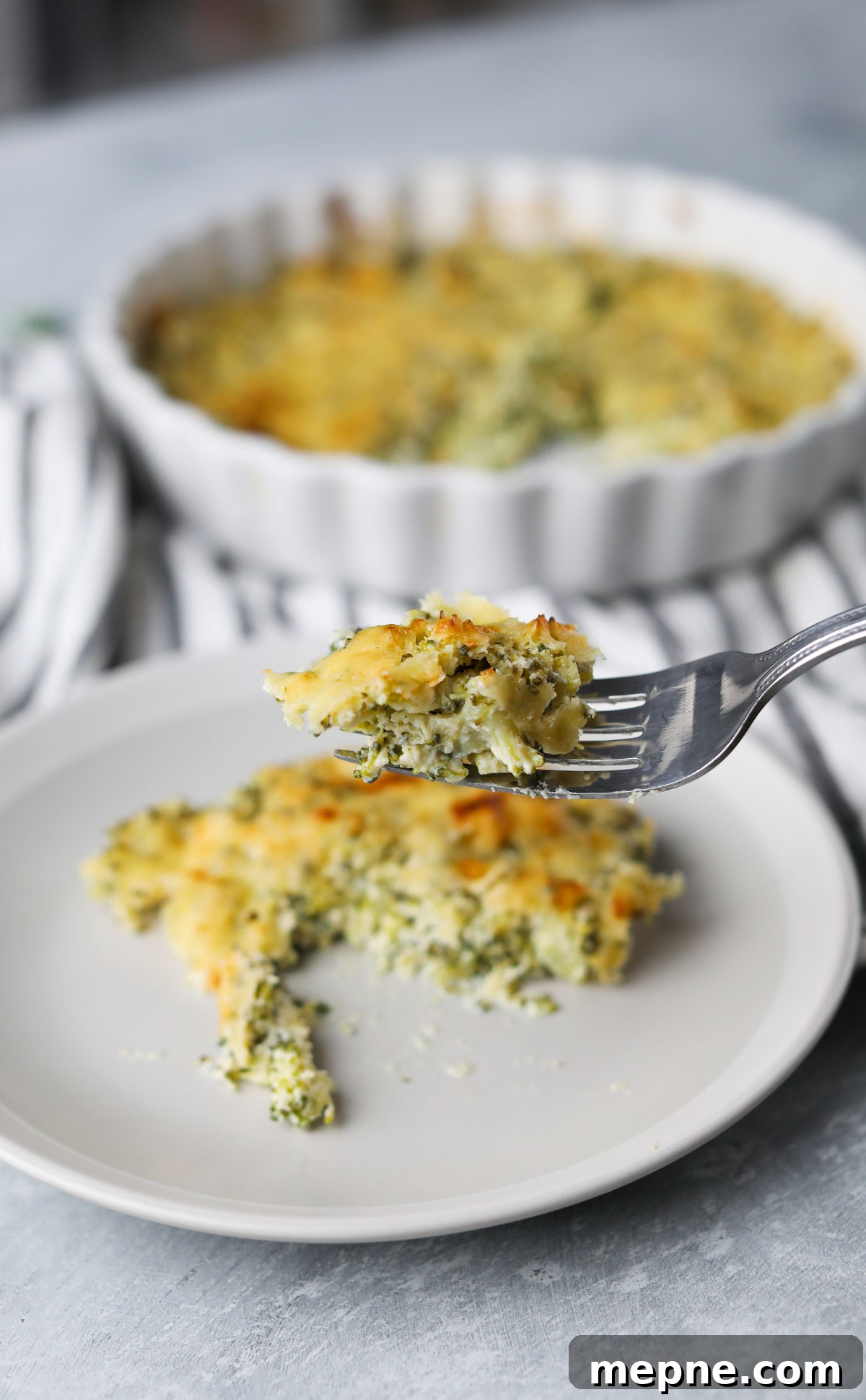 5-Ingredient Keto Broccoli Casserole Recipe 6 casserole slice on plate with forkful