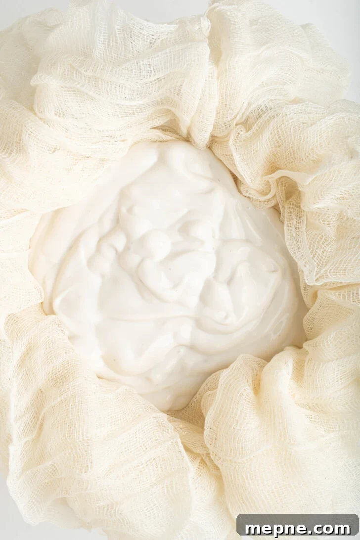 2 Ingredient Labneh Strained Yogurt Recipe 18 cashew yogurt straining in cheesecloth