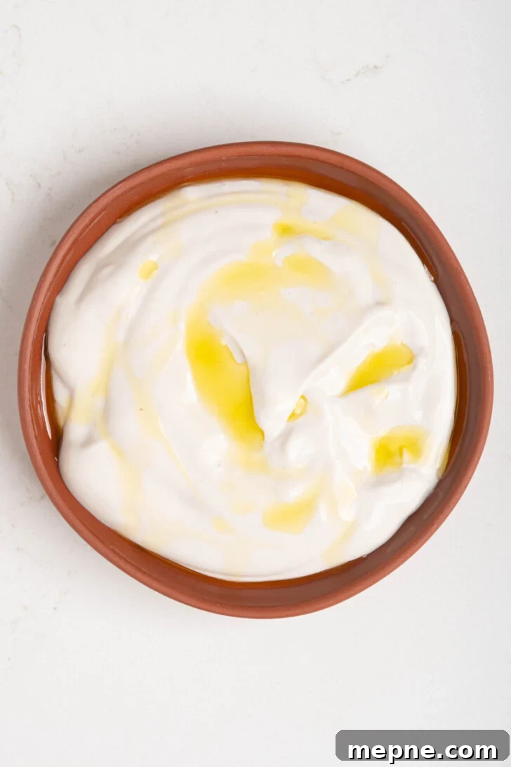 2 Ingredient Labneh Strained Yogurt Recipe 19 a bowl of dairy free labneh