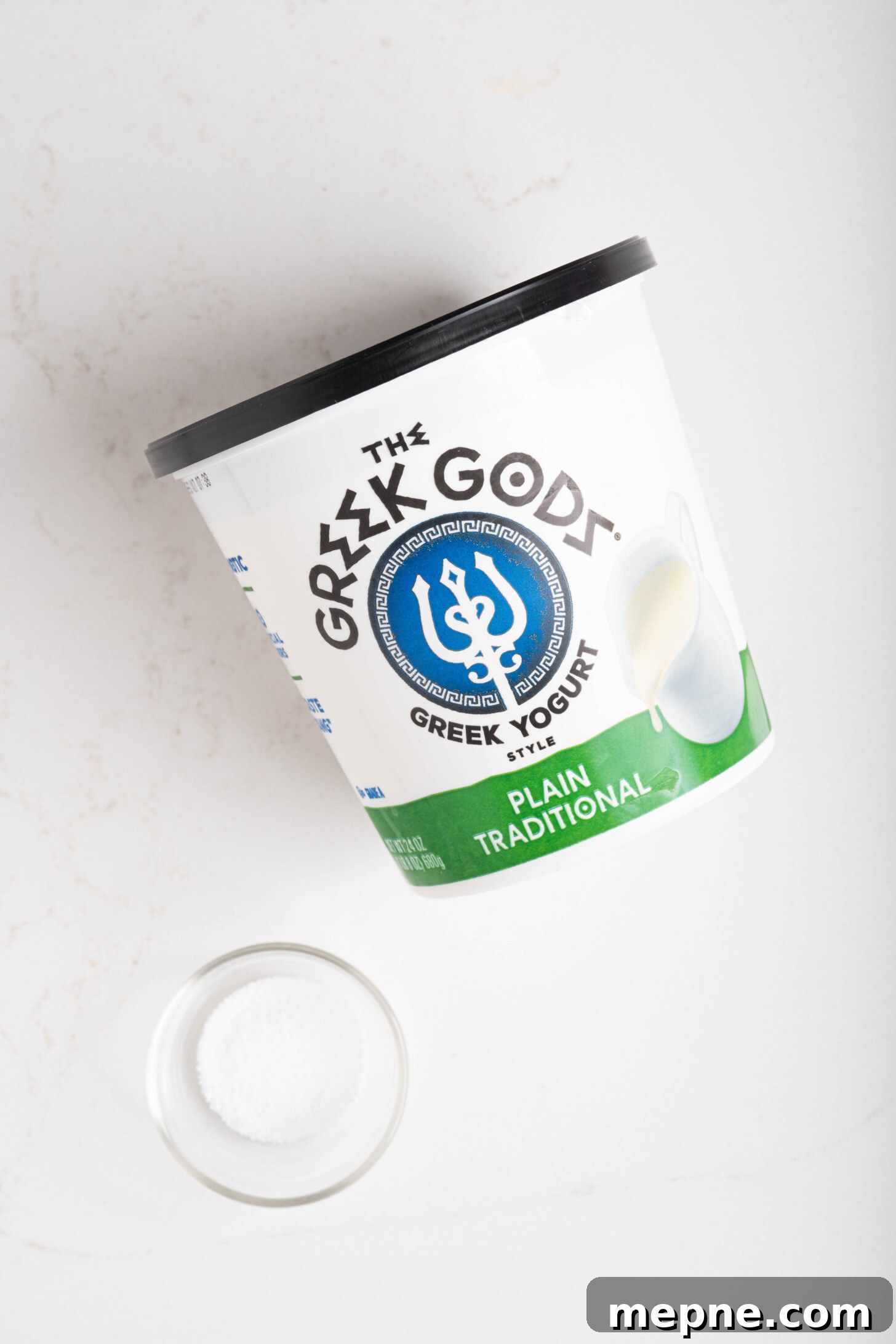2 Ingredient Labneh Strained Yogurt Recipe 3 a container of yogurt and a bowl of salt