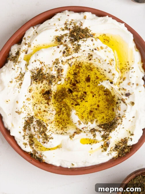A bowl of labneh with oil and za'atar