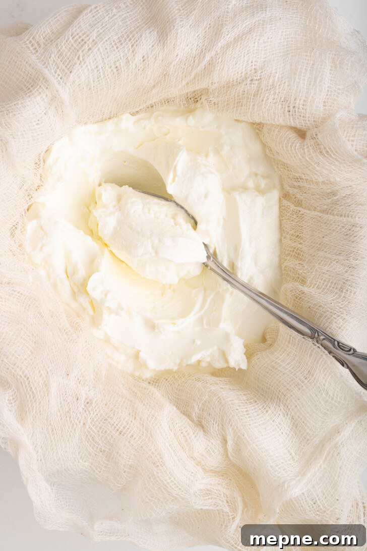 2 Ingredient Labneh Strained Yogurt Recipe 7 labneh in a strainer with cheesecloth