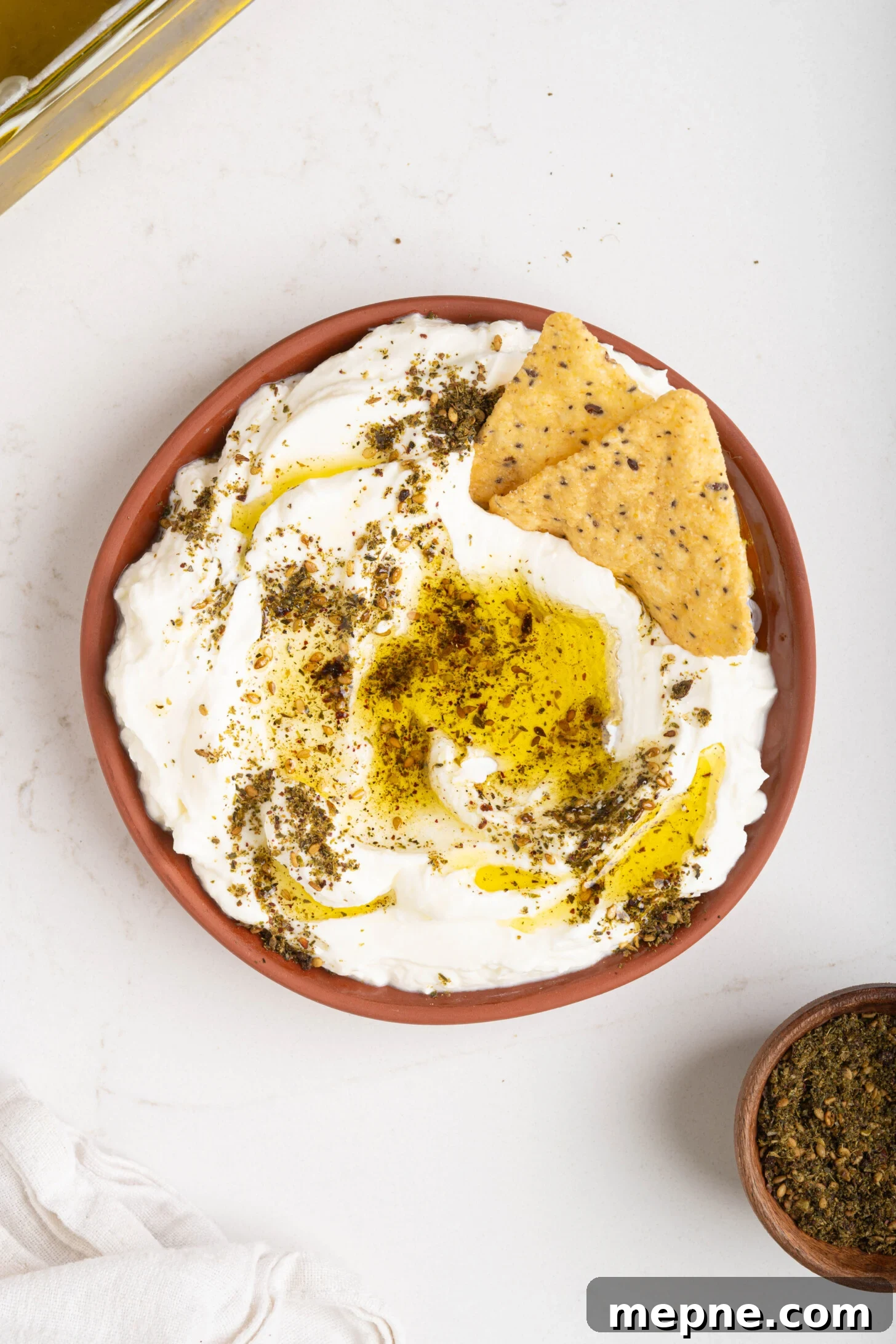 2 Ingredient Labneh Strained Yogurt Recipe 10 A bowl of labneh with oil and za'atar