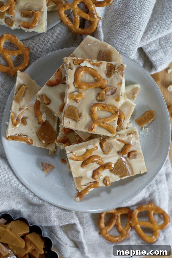 Homemade Cookie Butter White Chocolate Bark Recipe 10 cookie butter white chocolate bark piled on a plate