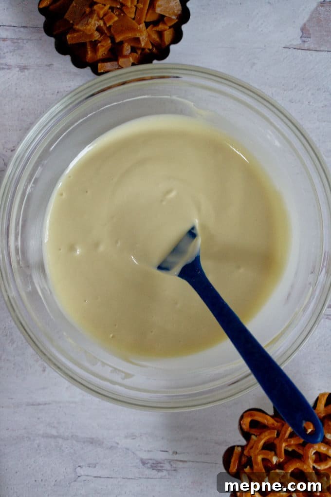 Homemade Cookie Butter White Chocolate Bark Recipe 6 melted white chocolate in a glass bowl