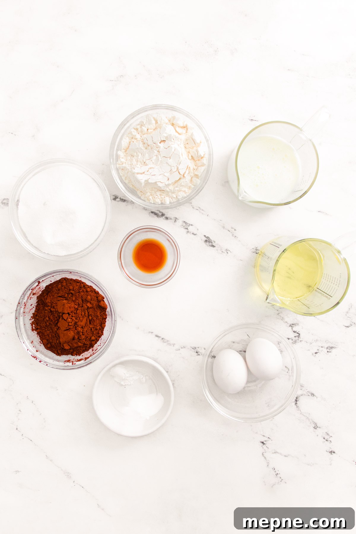 Ingredients to make chocolate cupcakes in prep bowls.