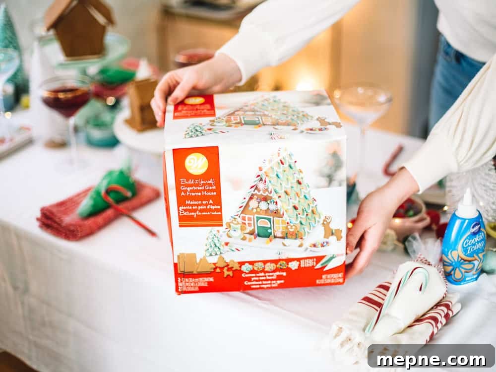 How to Host a Gingerbread House Decorating Party 6 Decorated gingerbread house with holiday candy details