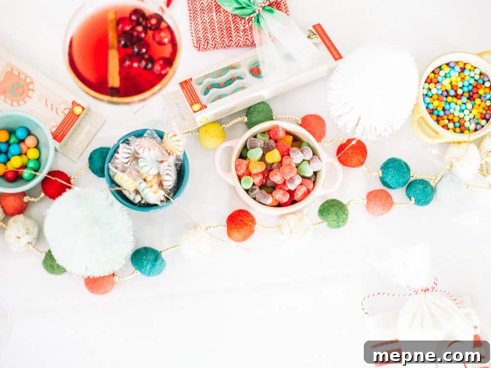 How to Host a Gingerbread House Decorating Party 8 Finished gingerbread house on a festive holiday table