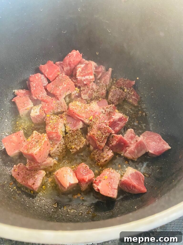 One-Pan Philly Cheesesteak Pasta Recipe 4 cooking the diced steak in a pot
