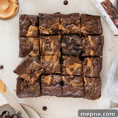Gluten-free peanut butter brownies sliced on a piece of parchment.