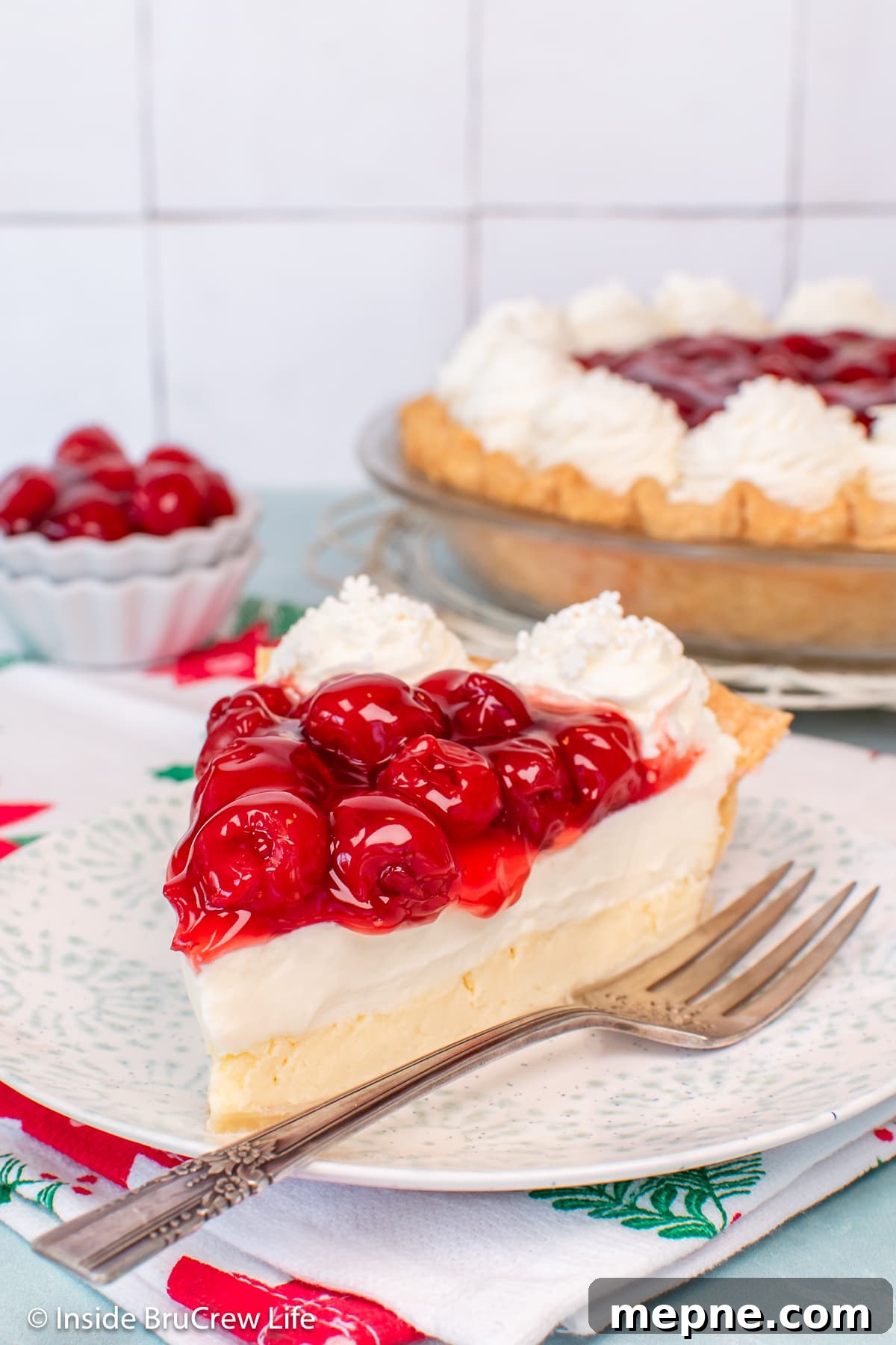 Cherry Pie with Cream Cheese Filling 2 A slice of Cherry cheesecake pie on a plate.