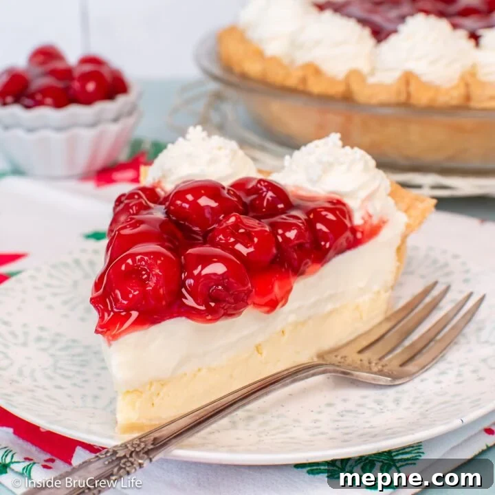 A slice of Cherry cheesecake pie on a plate.