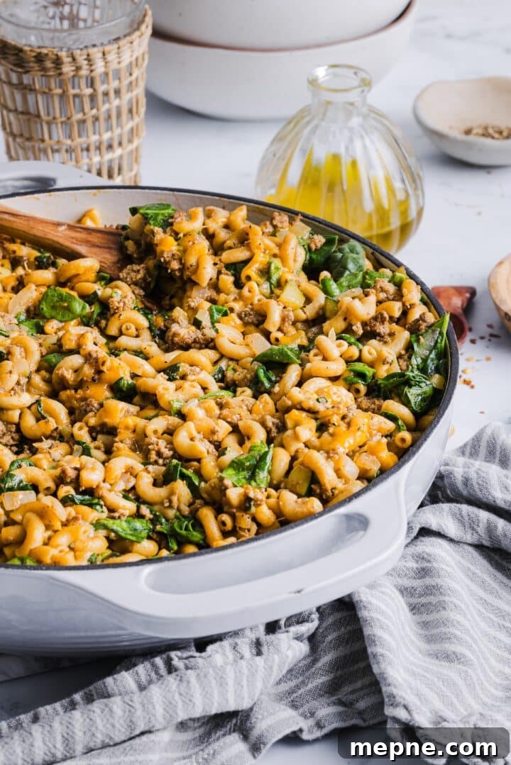 Lighter Homemade Hamburger Helper Recipe 2 3/4 view of a large, white skillet with healthier hamburger helper inside