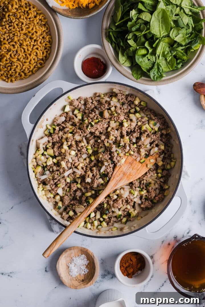 Lighter Homemade Hamburger Helper Recipe 4 Ground beef and chopped vegetables in a large pan