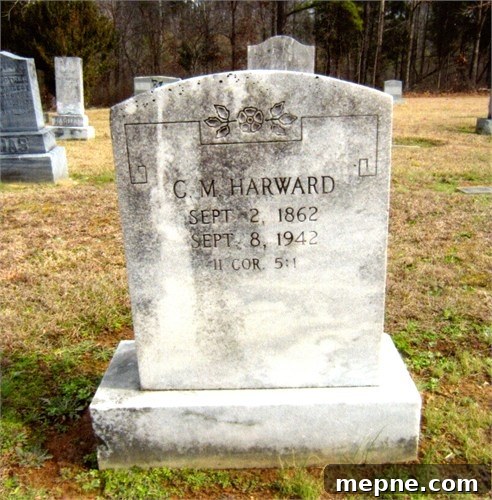 White tombstone of C. M Harward placed in cemetery