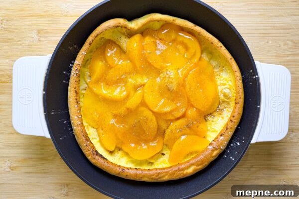 8 Mother’s Day Brunch Recipes to Make at Home 9 Peach Dutch baby pancake for brunch