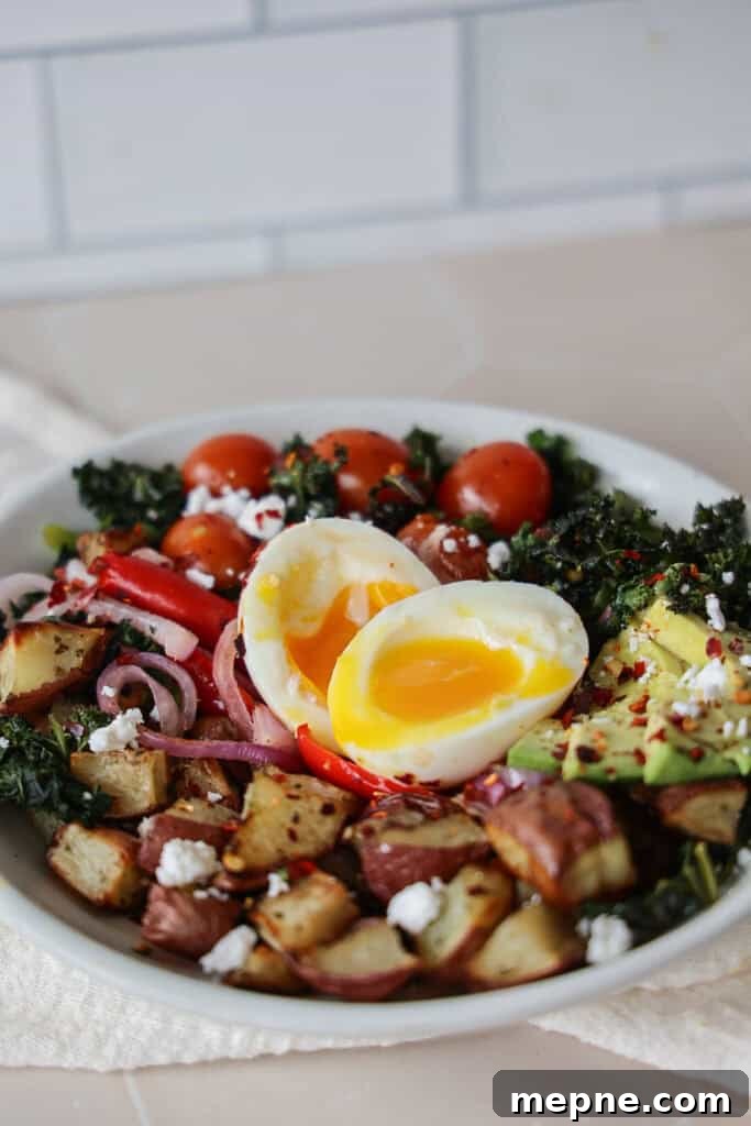 Protein Packed Breakfast Bowls for Busy Mornings 3 Savory breakfast bowl with eggs and potatoes.