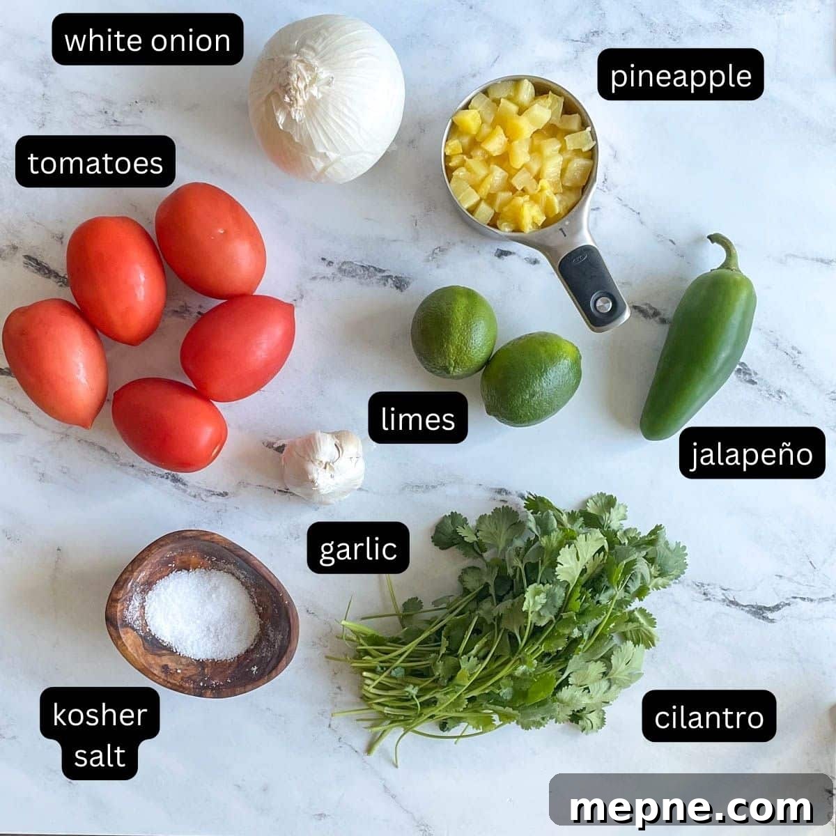 Pineapple Pico de Gallo Recipe: Tropical Salsa 3 Labeled ingredients for pineapple pico de gallo sit on a white marble counter.