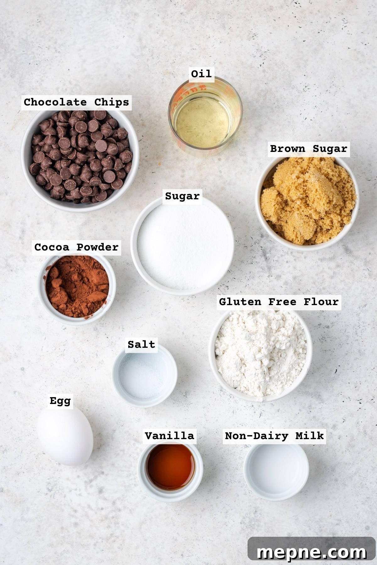Fudgy Small-Batch Brownies Recipe 2 Ingredients for small batch brownies on a white table.