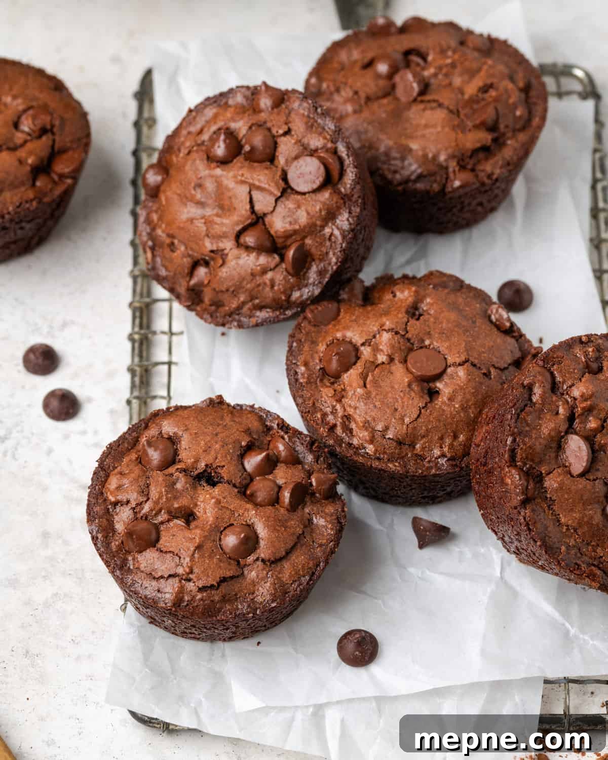 Fudgy Small-Batch Brownies Recipe 8 Six small brownies scattered on a cooling rack.