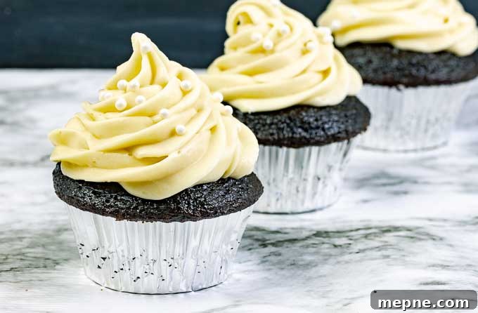 Guinness Dark Chocolate Cupcakes with Irish Cream Cheese Frosting 3 three Guinness Dark Chocolate Cupcakes with Irish Cream Cream Cheese Frosting in silver wrappers