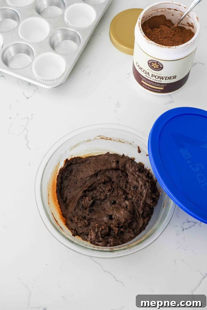 Moist and Fudgy Double Chocolate Muffins Recipe 10 Chilled chocolate muffin batter in a bowl.