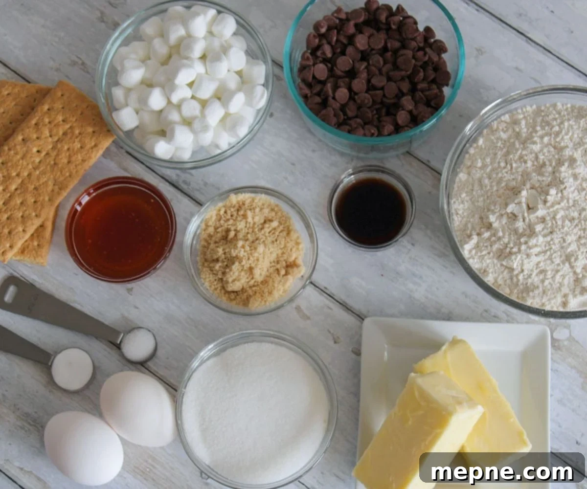 Ingredients in bowls for smore's cookies.