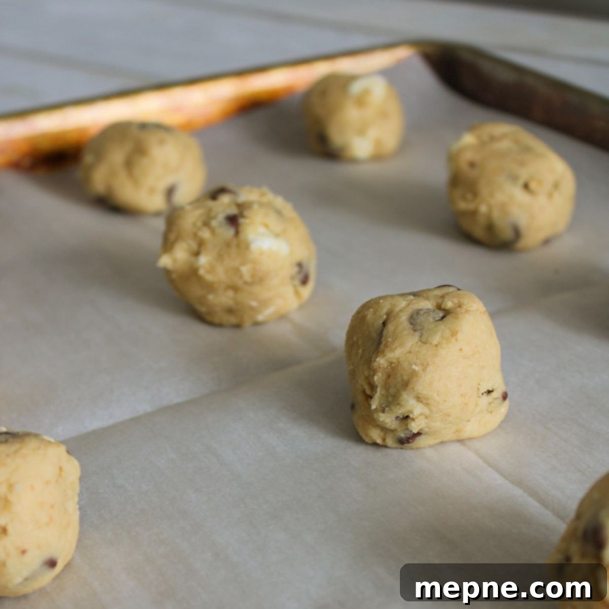 Balls of cookie dough ready for marshmallows.