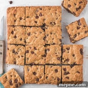 A batch of Gluten-free Oatmeal Chocolate Chip Bars cut into squares.