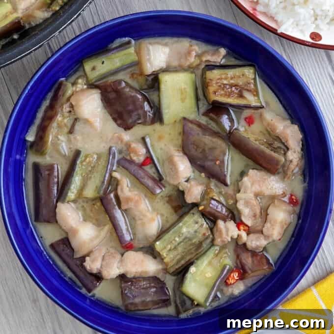Ginataang Talong in a blue serving bowl.