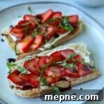 Strawberry ricotta toast topped with basil and balsamic.