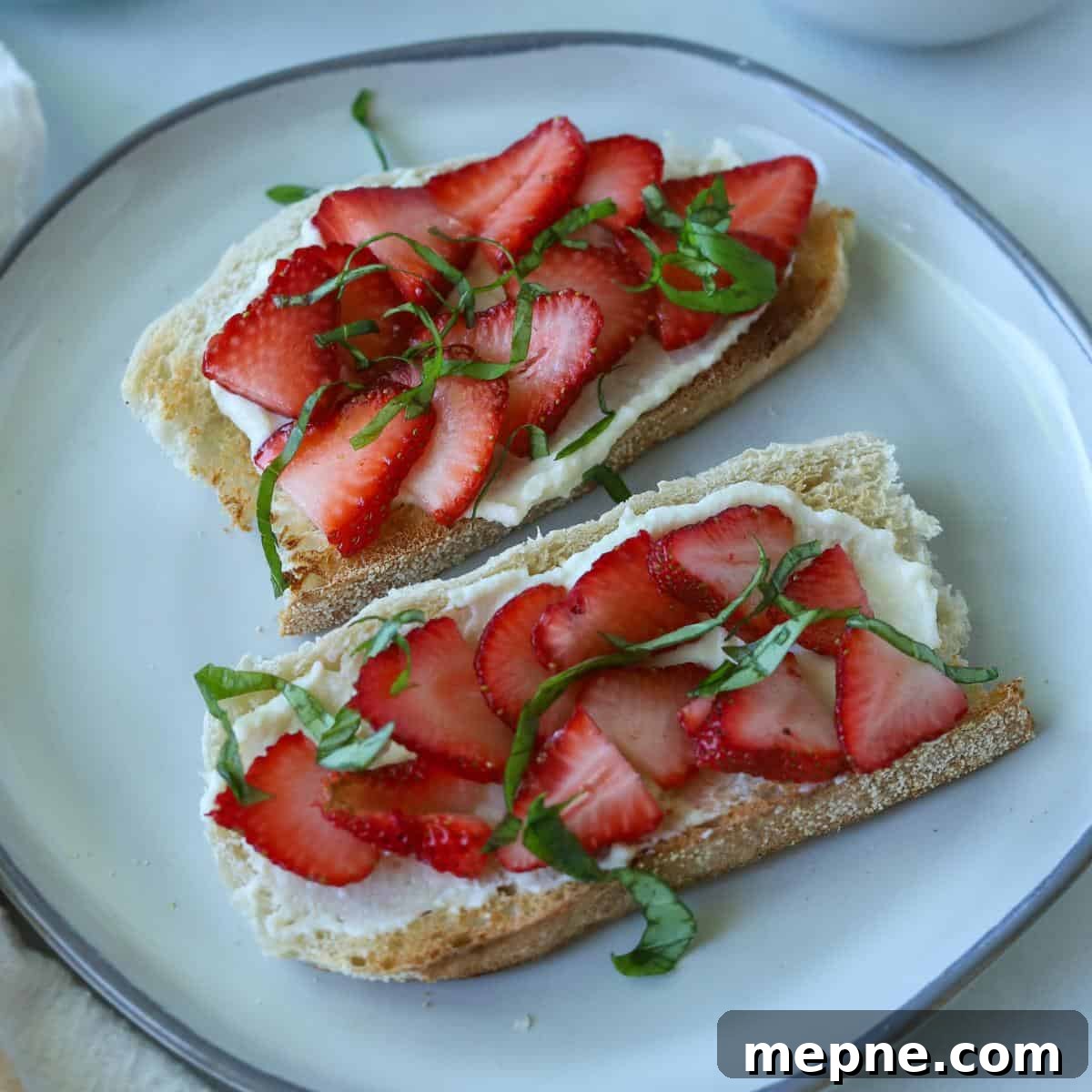 Strawberry Ricotta Toast with Honey Drizzle 7 toast with ricotta spread topped with strawberries and basil
