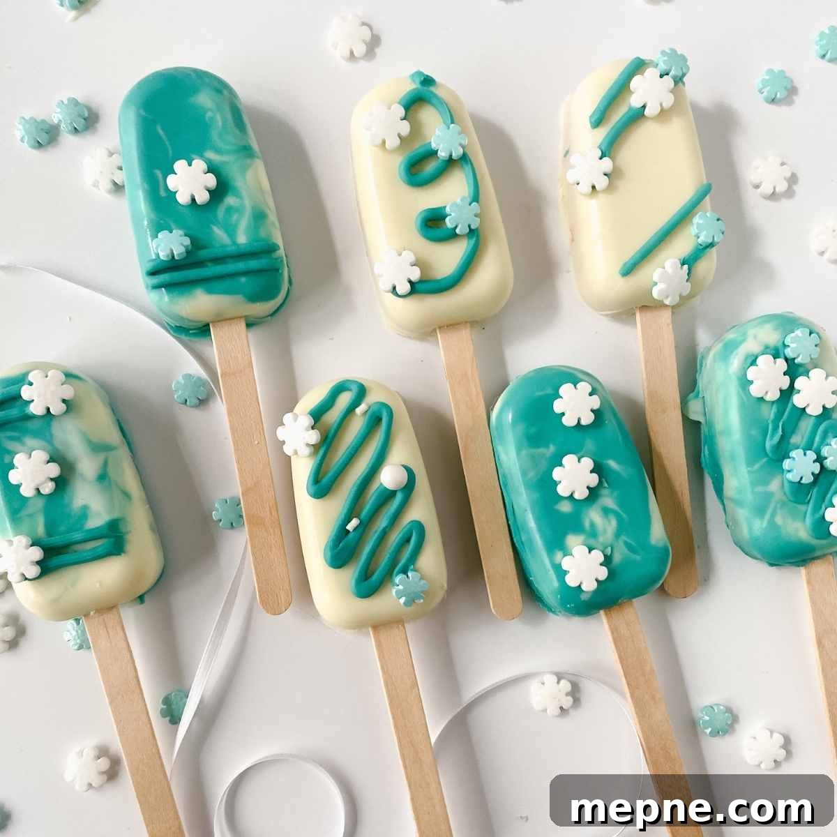 Top view of cakesicles decorated in a winter wonderland theme.