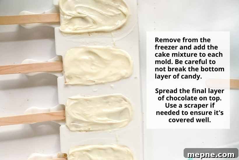 Top view of cakesicles in molds with white chocolate coating with text overlay.