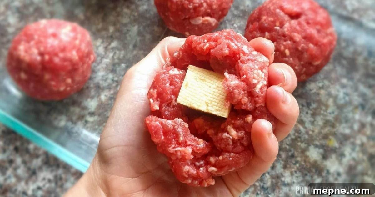 13 Low-Carb Holiday Appetizers to Impress Guests 11 Meatballs with cheese on a plate.