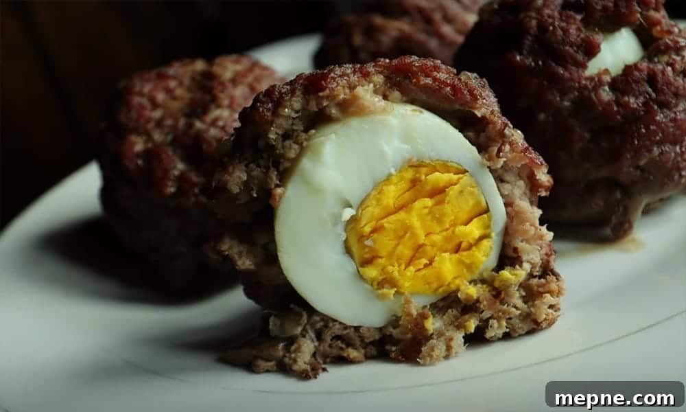 13 Low-Carb Holiday Appetizers to Impress Guests 6 Scotch eggs with ground beef one cut in half.