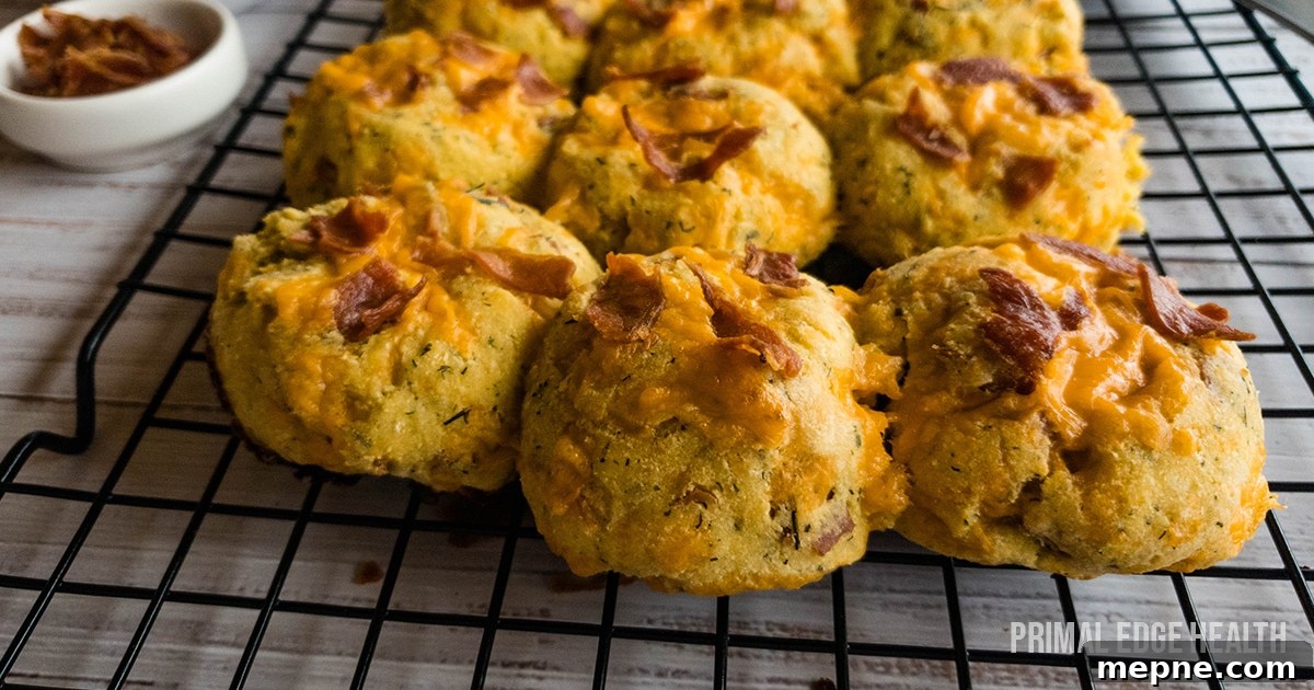 13 Low-Carb Holiday Appetizers to Impress Guests 7 A picture of biscuits with bacon and cheese on top cooling on rack.