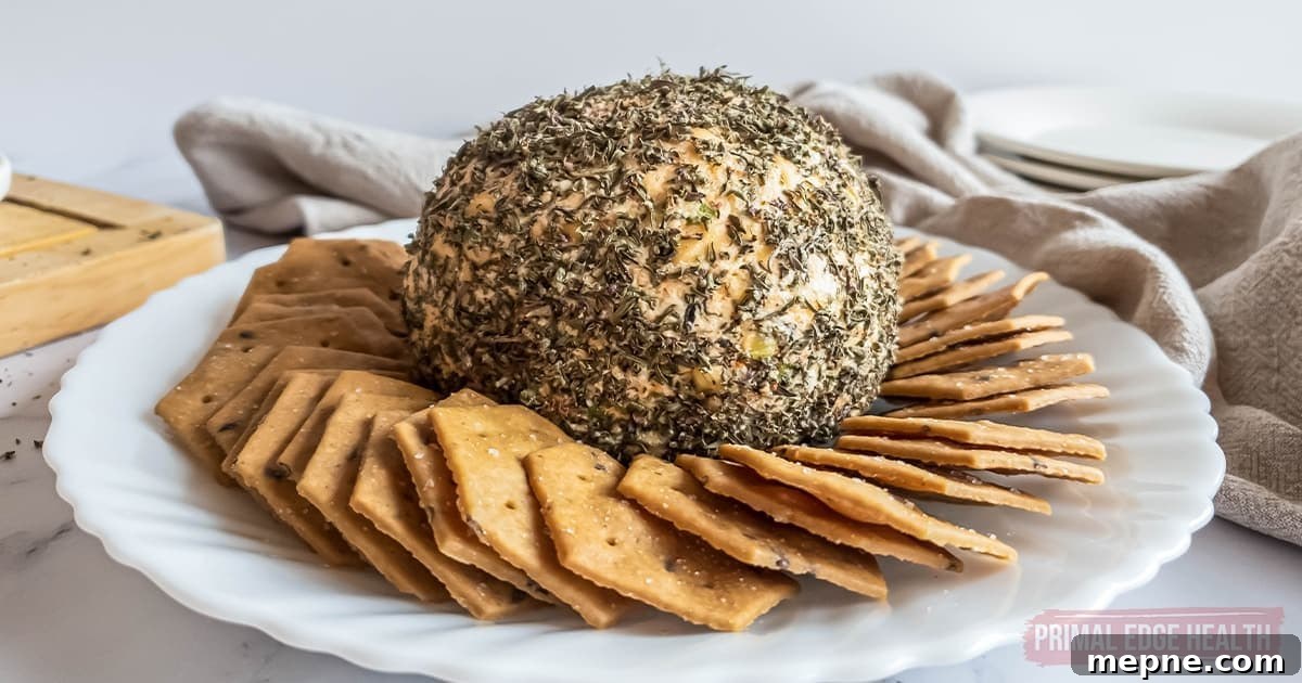 13 Low-Carb Holiday Appetizers to Impress Guests 9 Nut-free cheese ball and crackers on a plate.