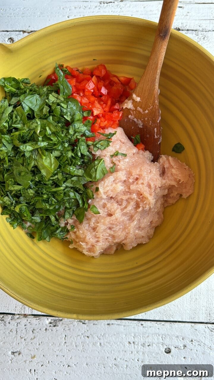 Smoky Chicken Patty Bowl: Weeknight Chicken Burger Recipe 8 ground chicken spinach and red pepper in a yellow bowl