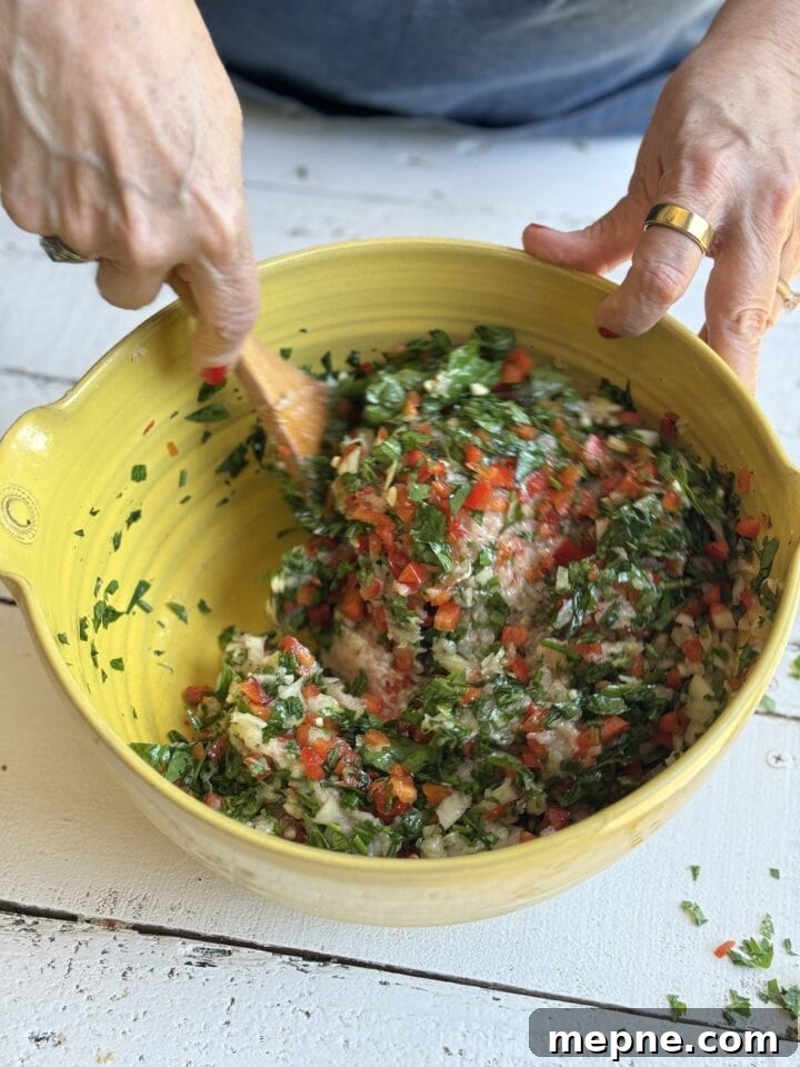 Smoky Chicken Patty Bowl: Weeknight Chicken Burger Recipe 10 mixing chicken patty mixture in a yellow bowl