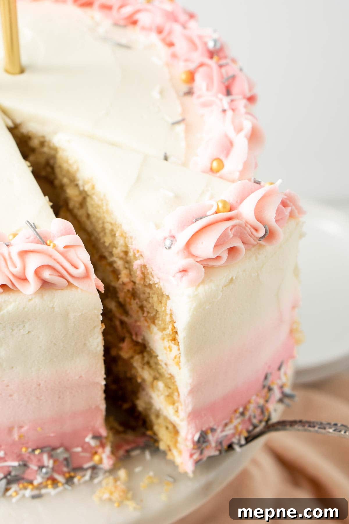 Vegan Vanilla Cake with Fluffy Frosting 11 Close up of a slice of cake being served.