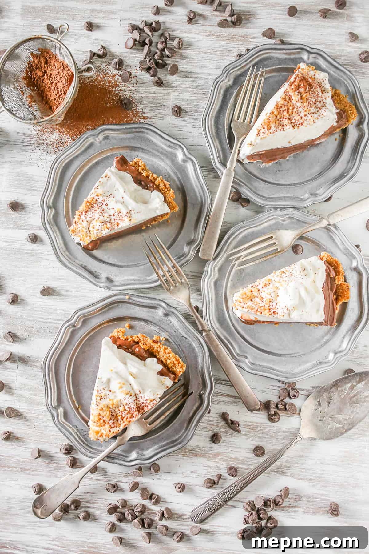 Slices of Chocolate Orange Pudding Pie Four slices of Chocolate Orange Pudding Pie on metal plates.