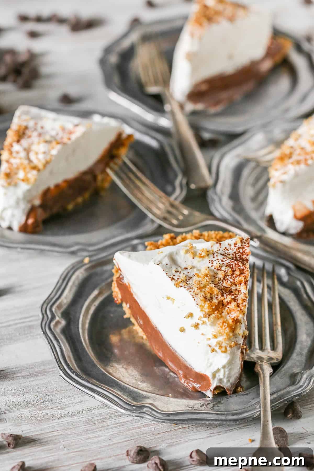 Chocolate Orange Pudding Pie Recipe 3 Chocolate Orange Pudding Pie served on a plate with a fork.