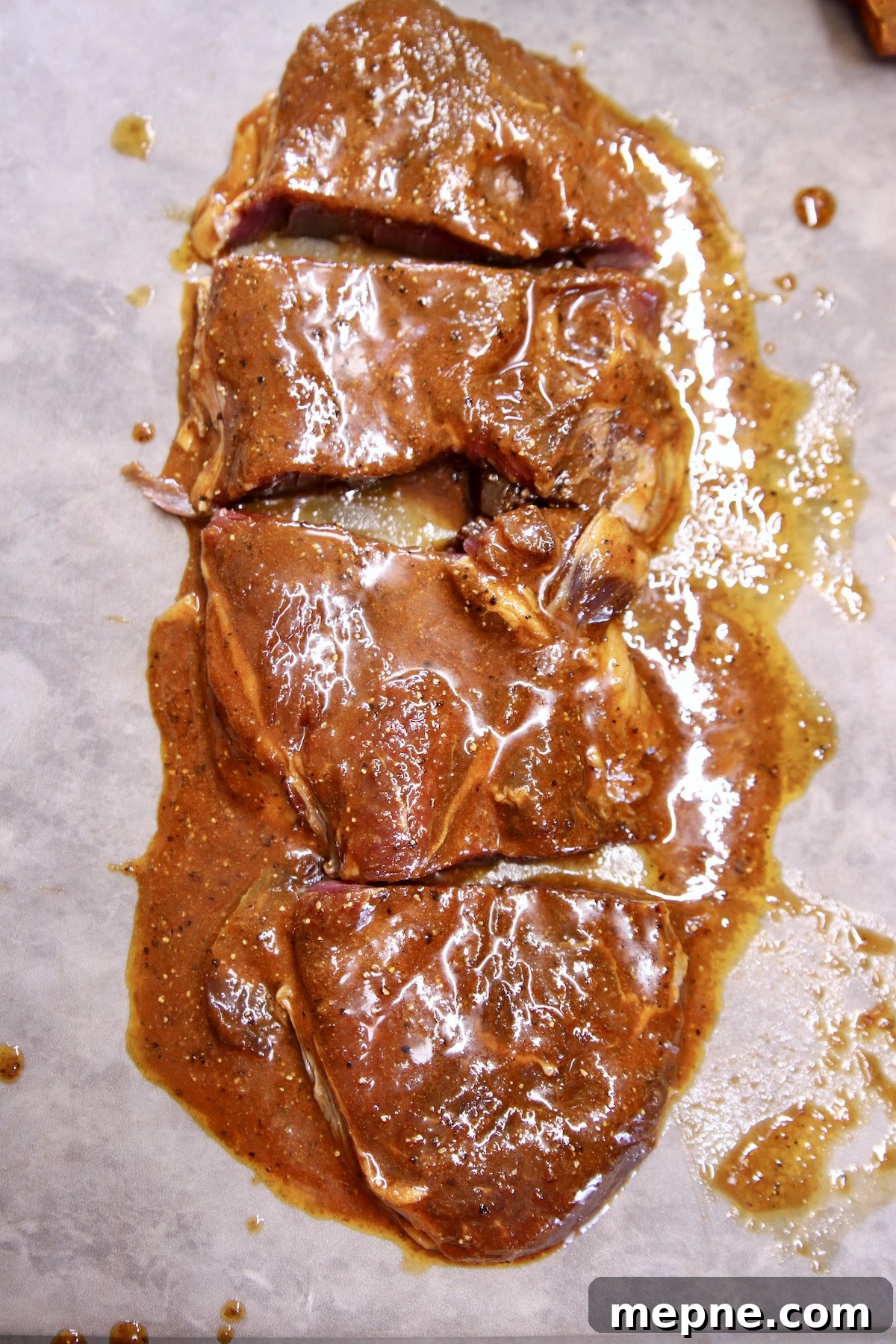 sirloin steak cut into 3 inch steaks - marinated.
