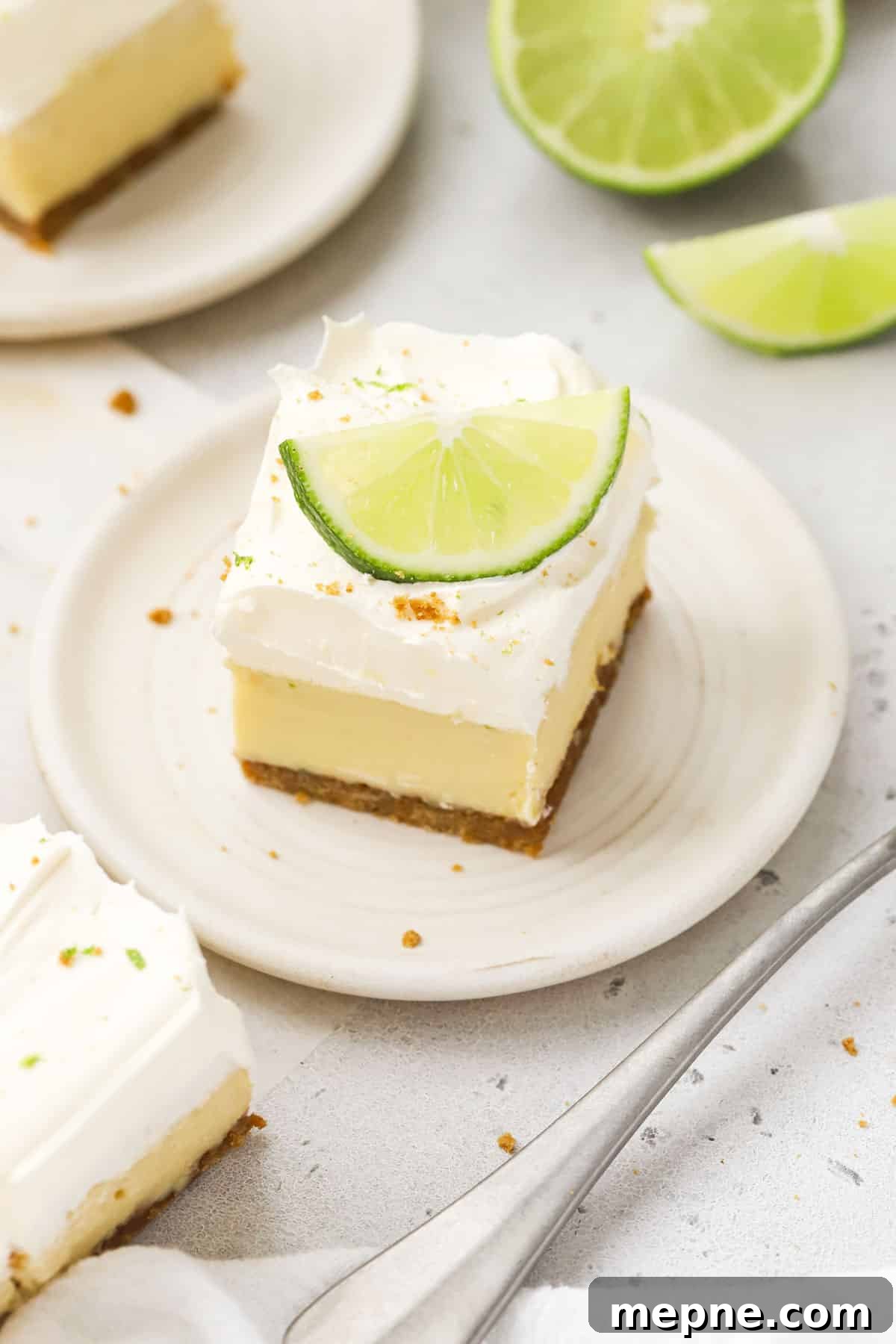 Gluten-Free Key Lime Pie Bars Recipe: Zesty Lime Squares 6 A key lime pie bar on a white dessert plate