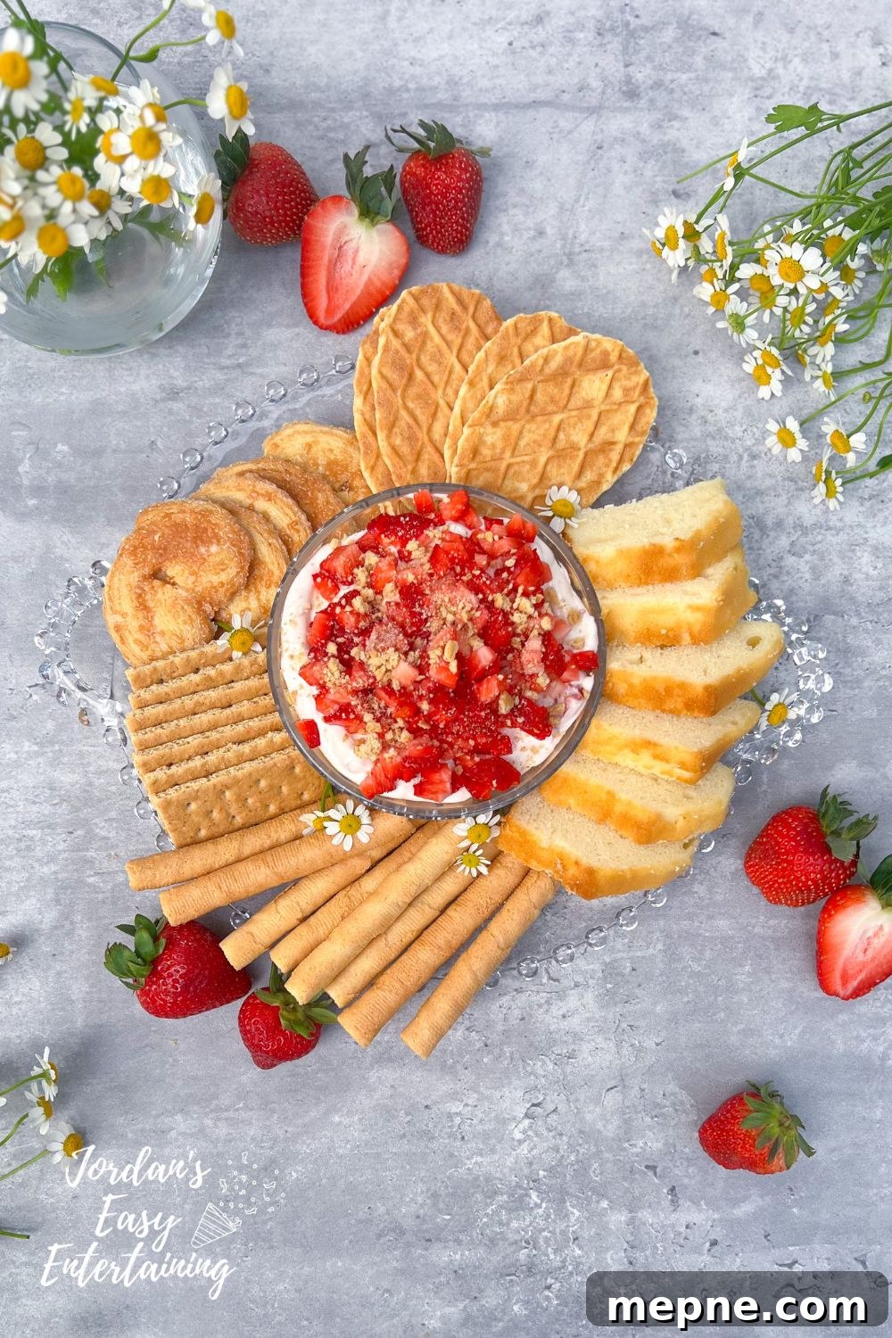 No-Bake Strawberry Cheesecake Dip: A Velvety, Decadent Treat 3 a no bake strawberry cheesecake dip served with pound cake, rolled wafers, graham crackers, puff pastry cookies and waffle cookies