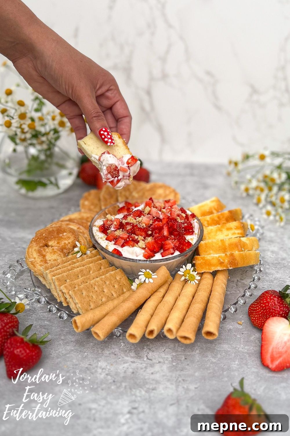 No-Bake Strawberry Cheesecake Dip: A Velvety, Decadent Treat 9 a piece of pound cake scooping up a yummy no bake strawberry cheesecake dip that is the perfect dessert for serving to a crowd