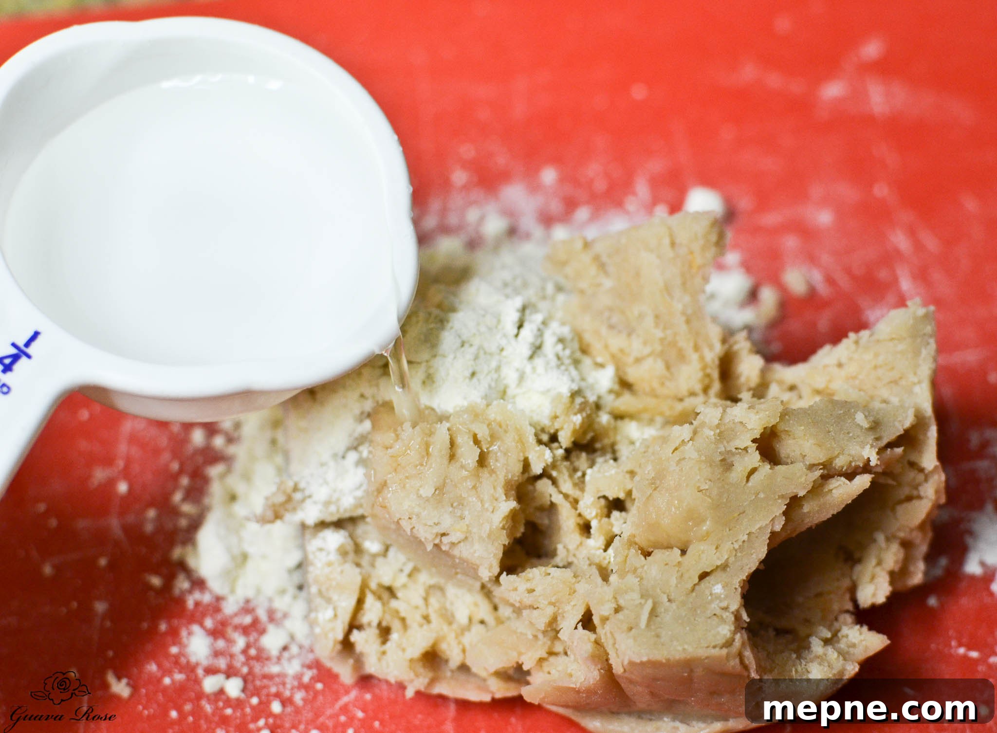 Adding water to pa'i'ai and flour